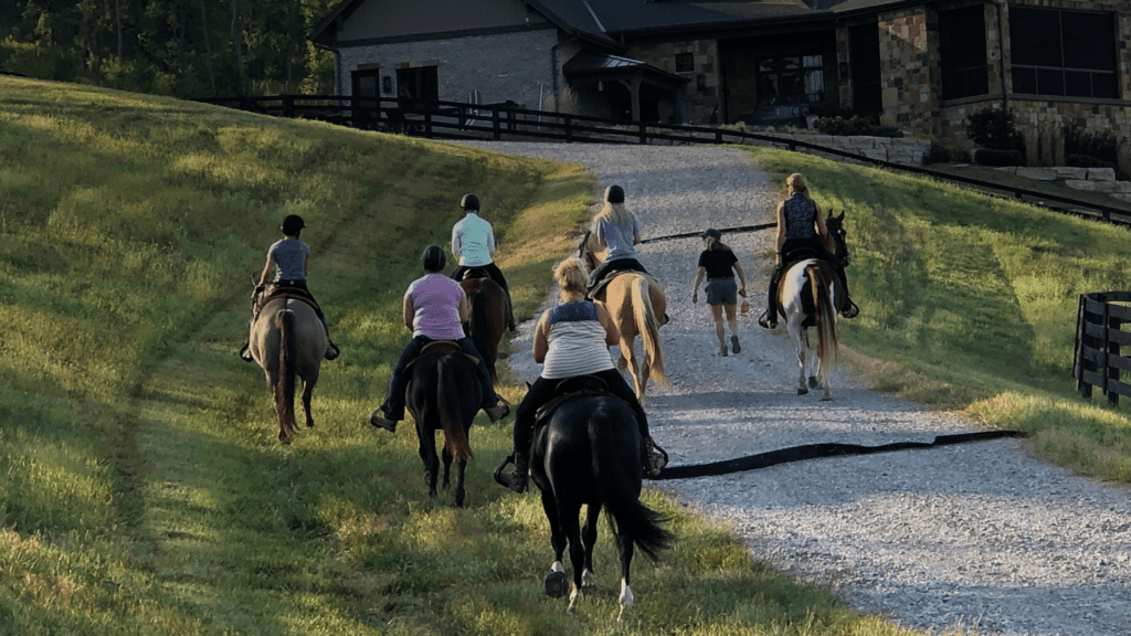 A group riding horses at Rivers Pointe Estates a horseback riding community