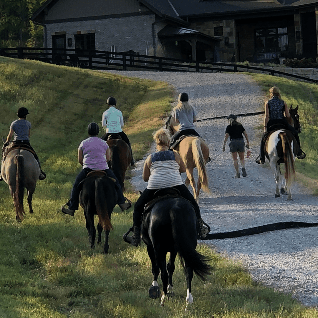 A group riding horses at Rivers Pointe Estates a horseback riding community